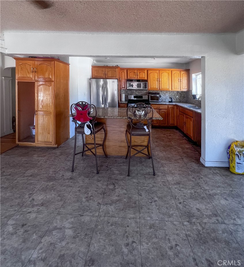 4301 Arlington Avenue Los Angeles, CA 90008 - Photo 17 of 18 a view of a workspace with furniture and a window