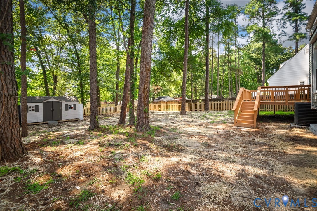 8928 Hawkbill Road North Chesterfield, VA 23237 - Photo 39 of 50 Expansive backyard featuring a wood deck with stai