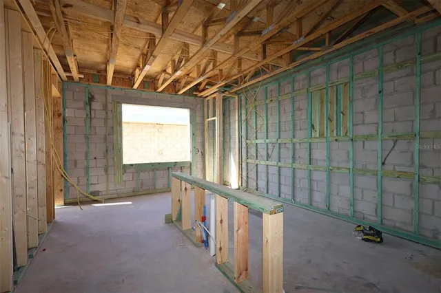 a view of a room with wooden walls