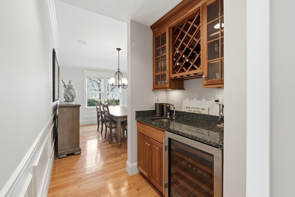22 McNeil Circle, Unit 22 Hopkinton, MA 01748 - Photo 13 of 42 a kitchen with granite countertop a sink stove and cabinets
