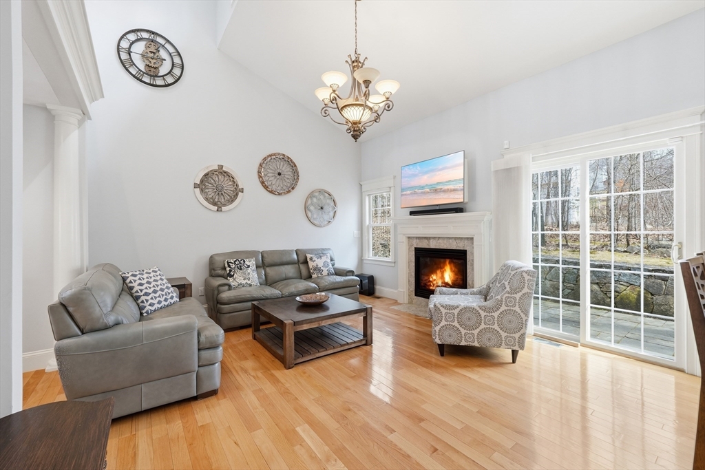 22 McNeil Circle, Unit 22 Hopkinton, MA 01748 - Photo 14 of 42 a living room with furniture and a fireplace
