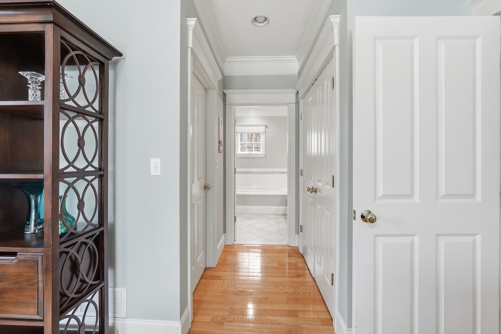 22 McNeil Circle, Unit 22 Hopkinton, MA 01748 - Photo 20 of 42 a view of a hallway with wooden floor and entryway