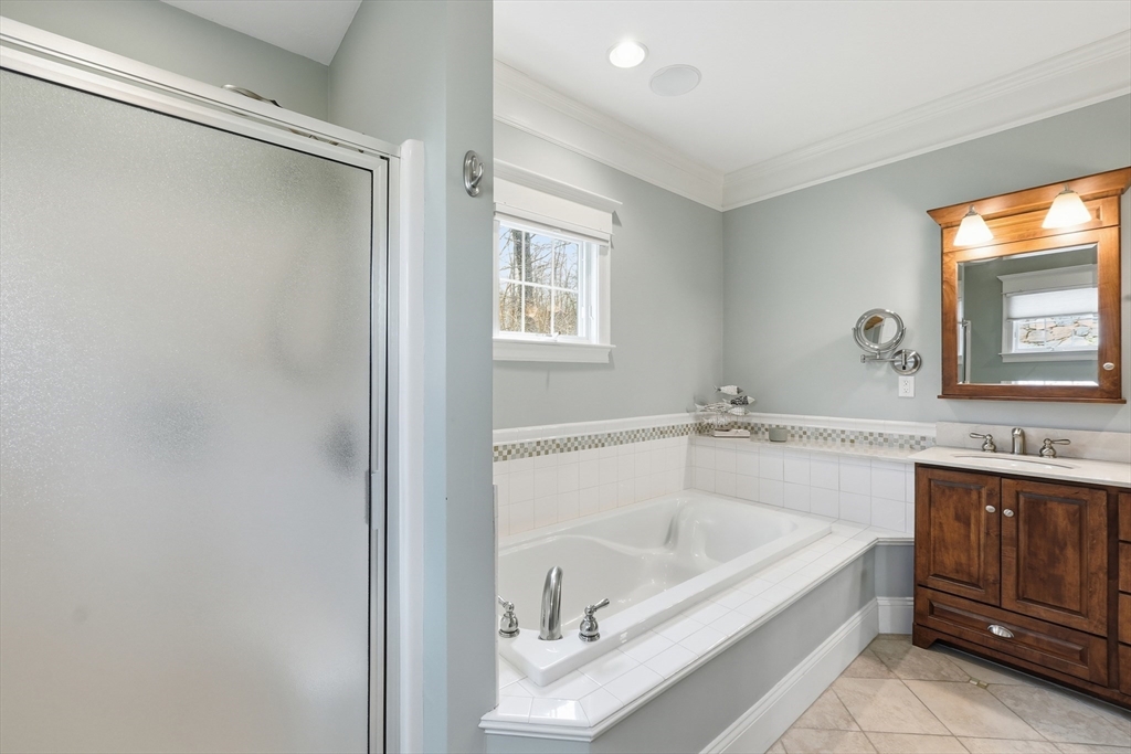 22 McNeil Circle, Unit 22 Hopkinton, MA 01748 - Photo 21 of 42 a white bath tub sitting next to a white sink