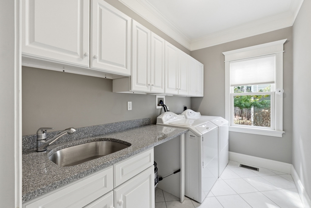 22 McNeil Circle, Unit 22 Hopkinton, MA 01748 - Photo 25 of 42 a kitchen with stainless steel appliances granite countertop a sink stove and cabinets
