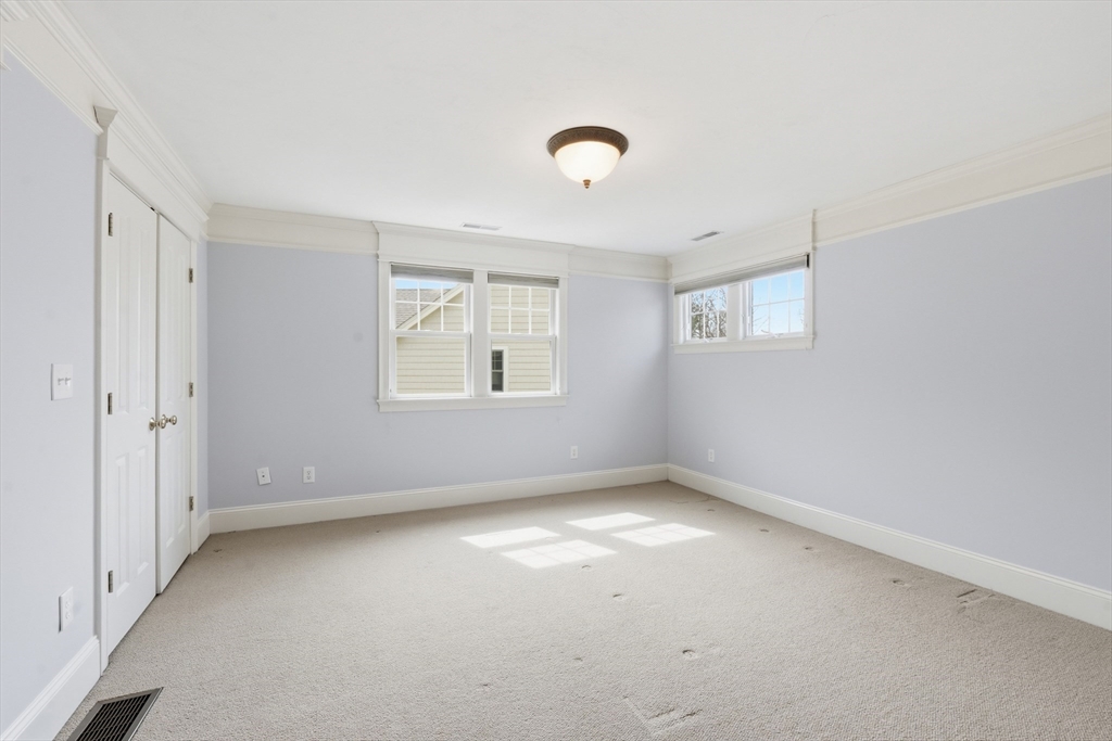 22 McNeil Circle, Unit 22 Hopkinton, MA 01748 - Photo 29 of 42 an empty room with a empty space and windows