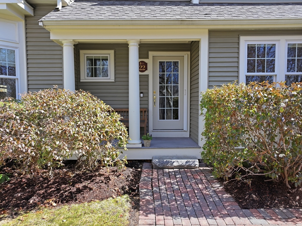 22 McNeil Circle, Unit 22 Hopkinton, MA 01748 - Photo 3 of 42 a view of a house with a yard