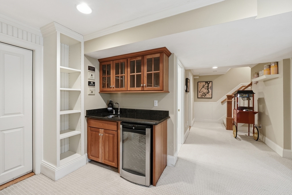 22 McNeil Circle, Unit 22 Hopkinton, MA 01748 - Photo 35 of 42 a kitchen with stainless steel appliances granite countertop a stove and a refrigerator