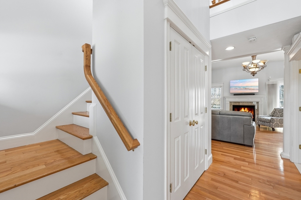 22 McNeil Circle, Unit 22 Hopkinton, MA 01748 - Photo 4 of 42 a view of a kitchen with furniture and wooden floor