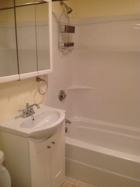 2 Genetti Circle, Unit 2 Bedford, MA 01730 - Photo 5 of 6 a bathroom with a sink and a mirror