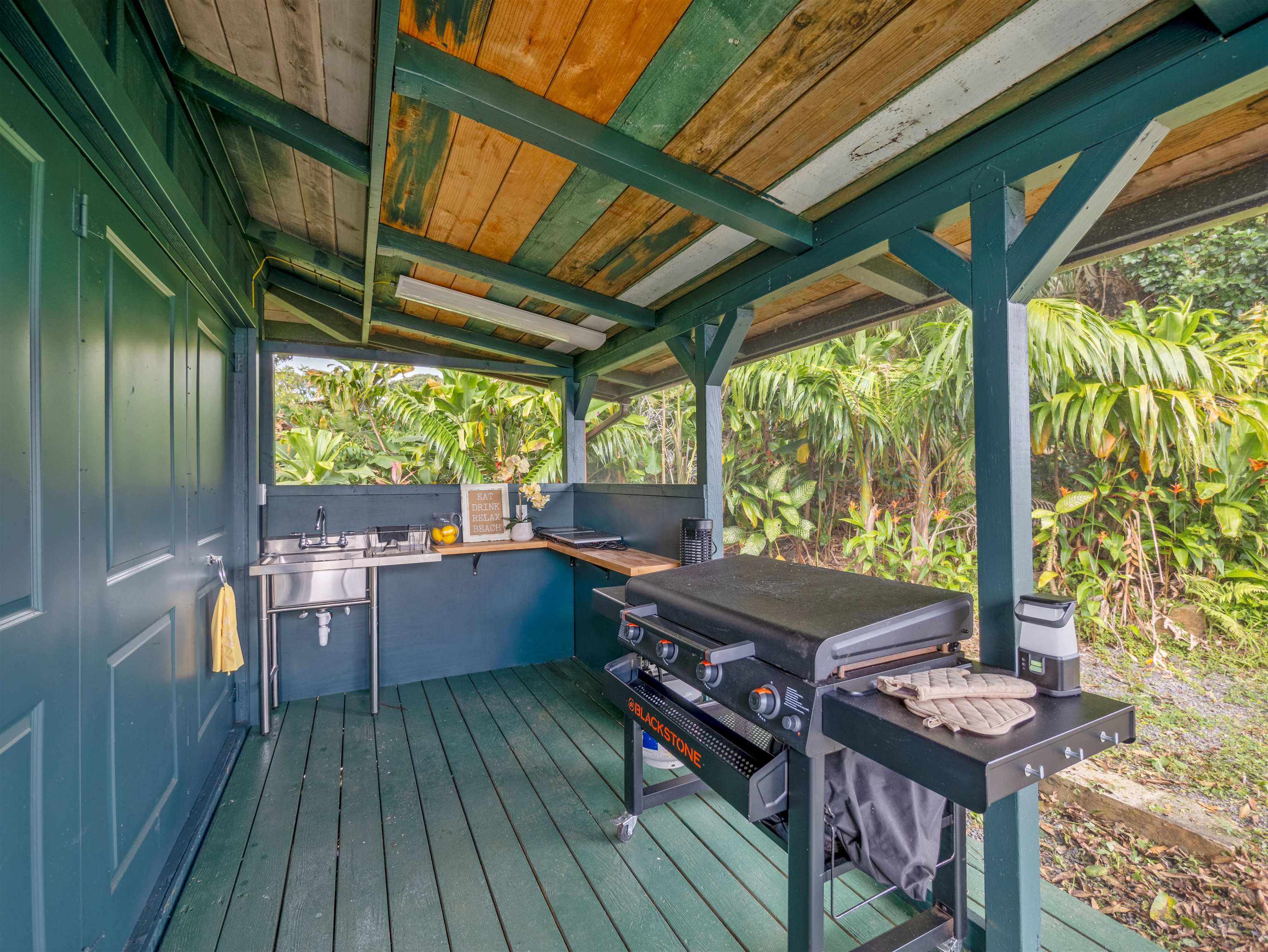 44 Hanauana Road Haiku, HI 96708 - Photo 13 of 45 a view of a two chairs in the balcony next to a yard