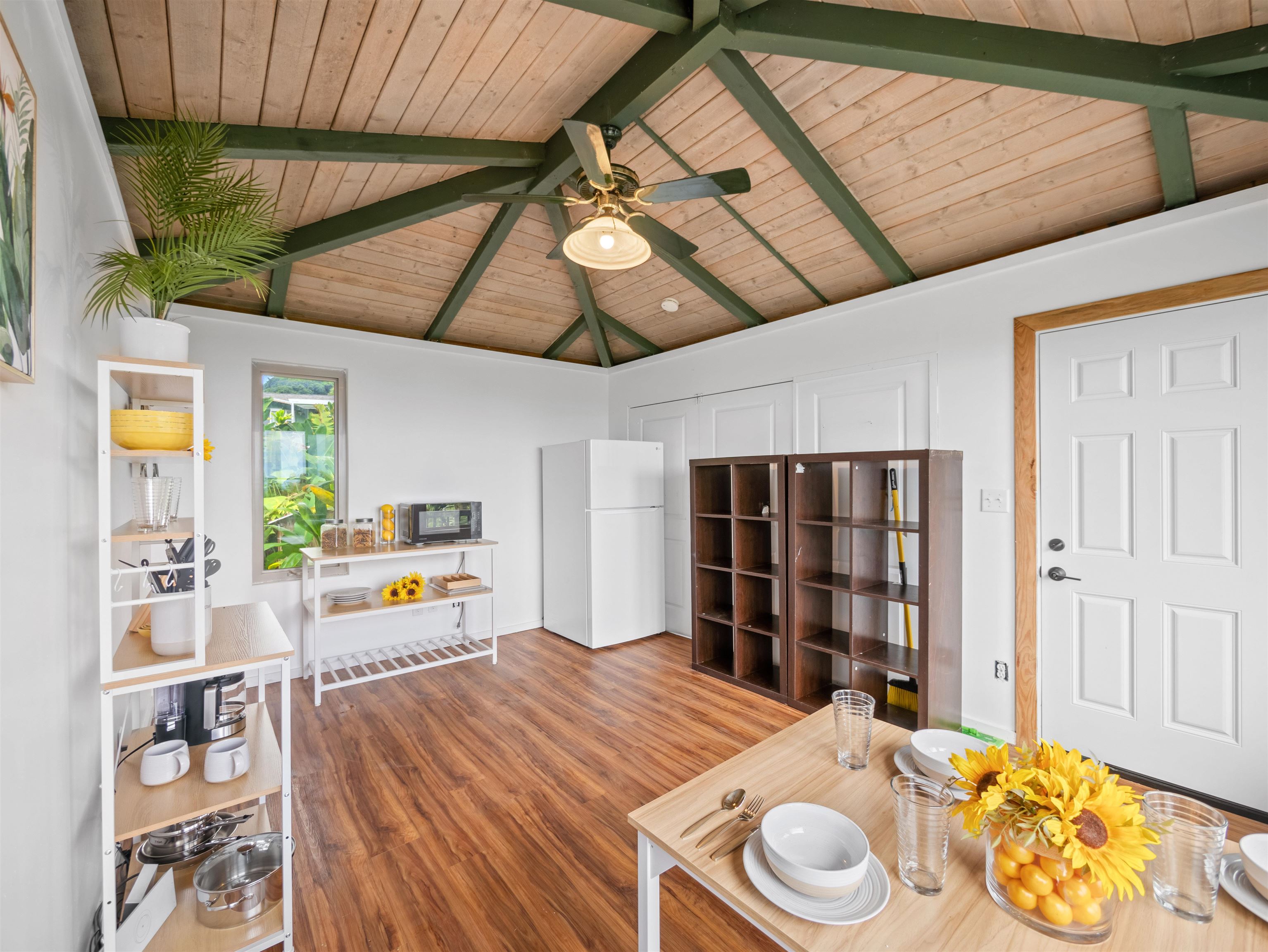 44 Hanauana Road Haiku, HI 96708 - Photo 16 of 45 a bed room with a bed and a book shelf