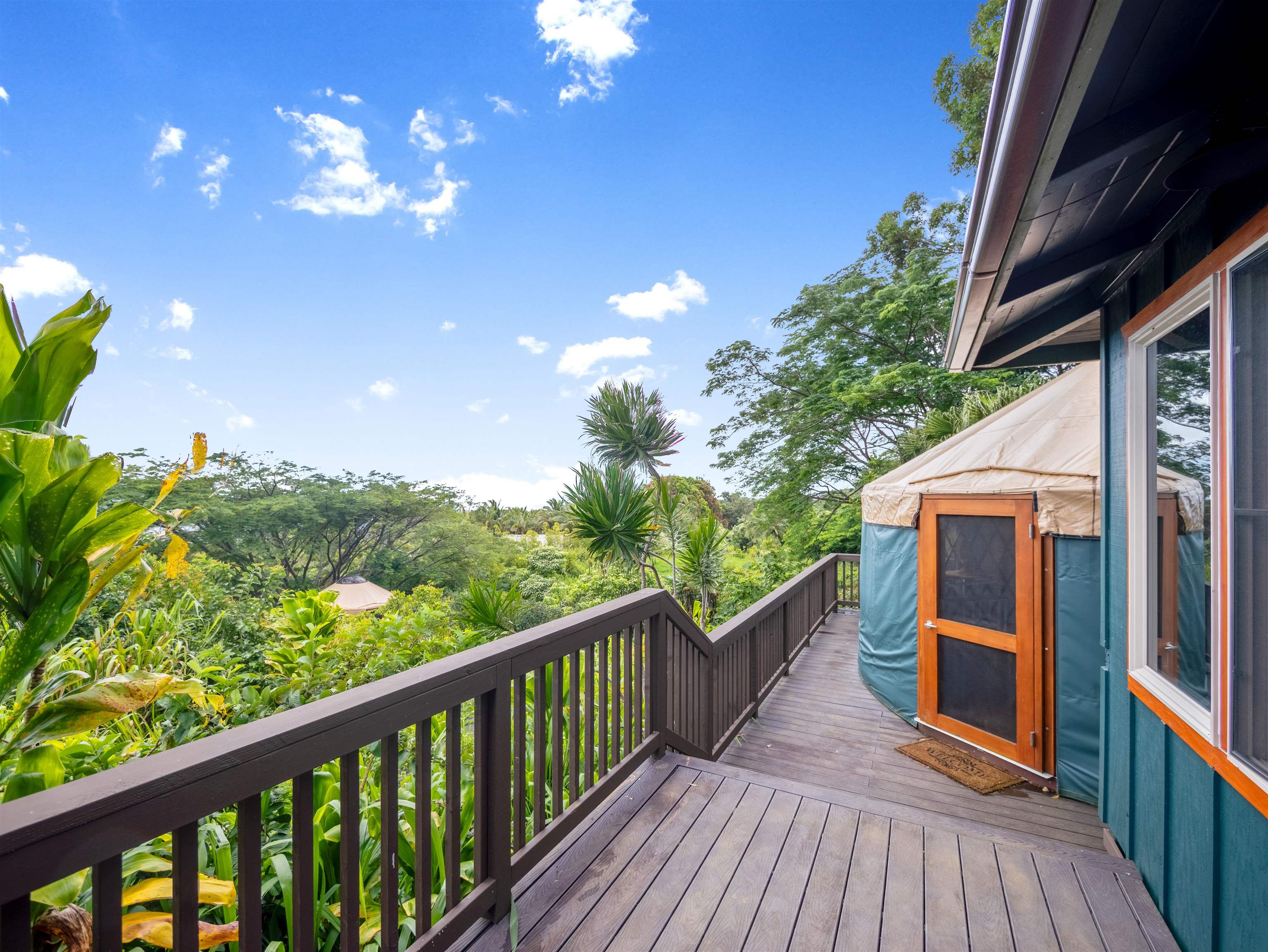44 Hanauana Road Haiku, HI 96708 - Photo 18 of 45 a view of a balcony with wooden floor