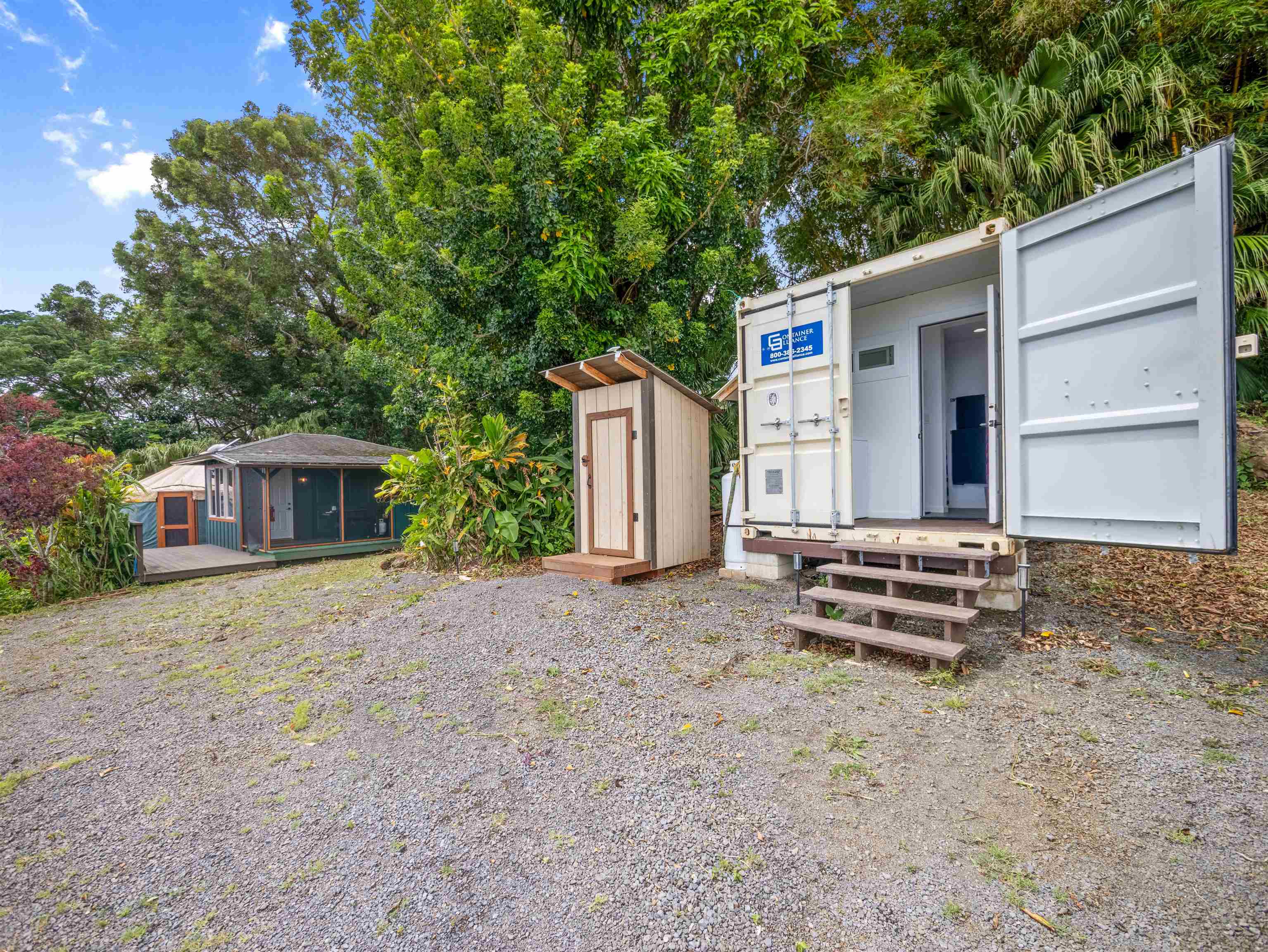 44 Hanauana Road Haiku, HI 96708 - Photo 8 of 45 a backyard of a house with wooden fence and a tree