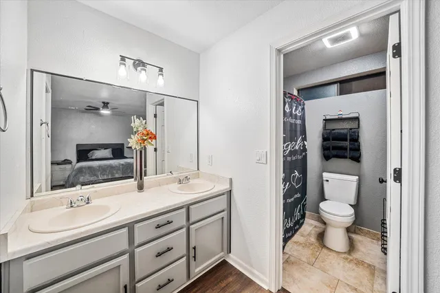 a bedroom with a bed window and a dresser