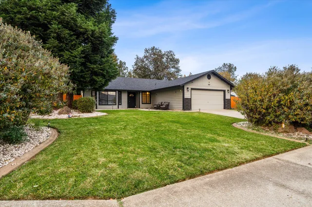 a view of a backyard with a tub and wooden fence