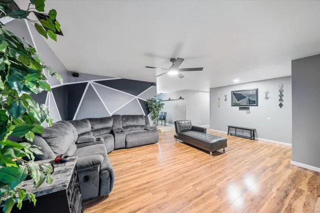 a view of a dining room with furniture and chandelier