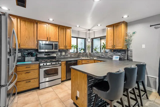 a bedroom with furniture and a flat screen tv