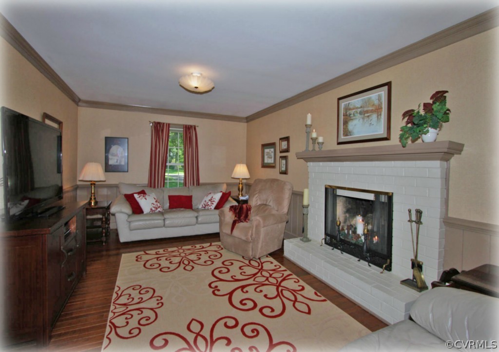 13321 Kingsmill Road Midlothian, VA 23113 - Photo 5 of 14 a living room with furniture and a fireplace