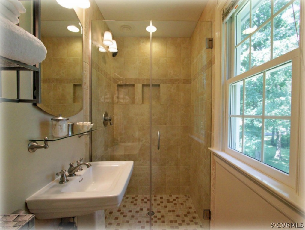 13321 Kingsmill Road Midlothian, VA 23113 - Photo 10 of 14 a bathroom with a sink a toilet and shower