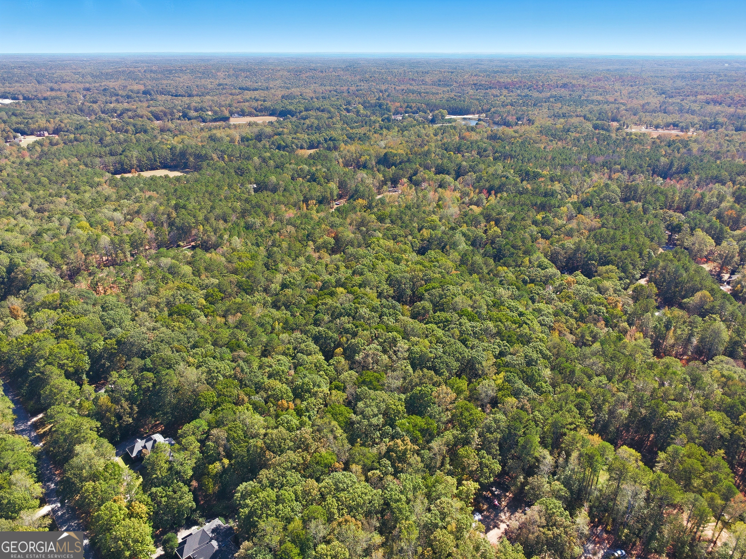 0 Busbin Road Fayetteville, GA 30215 - Photo 3 of 8 an aerial view of a houses with a street