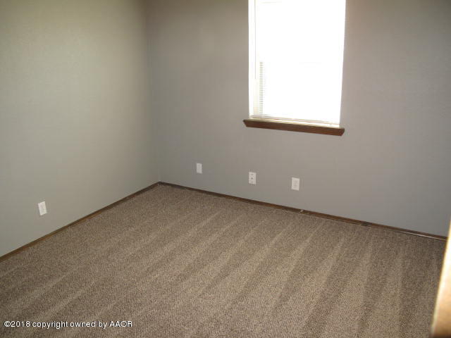 8108 Goodnight Trail Amarillo, TX 79110 - Photo 11 of 17 a view of a room that has a window in it