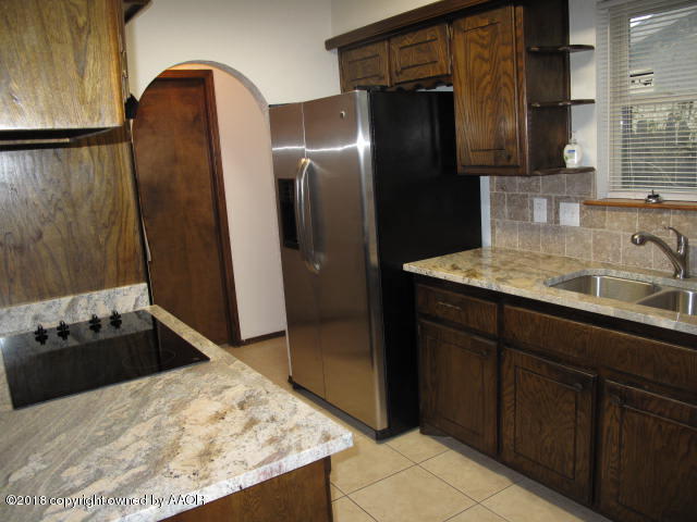 8108 Goodnight Trail Amarillo, TX 79110 - Photo 17 of 17 a bathroom with a sink and a mirror