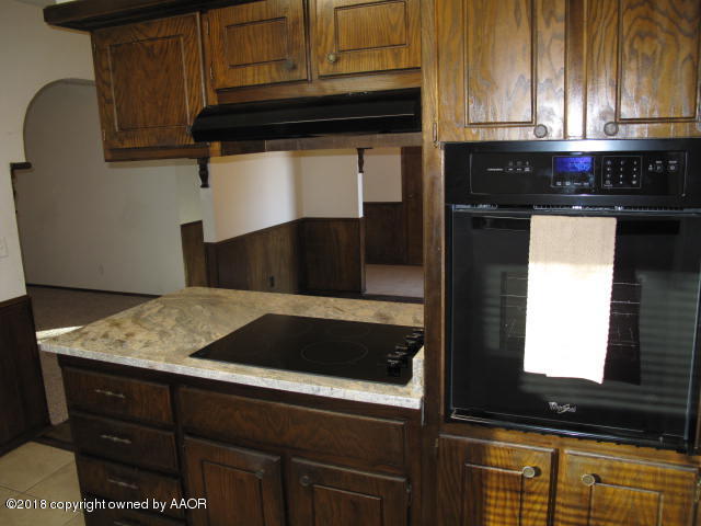 8108 Goodnight Trail Amarillo, TX 79110 - Photo 7 of 17 a kitchen with a sink and cabinets