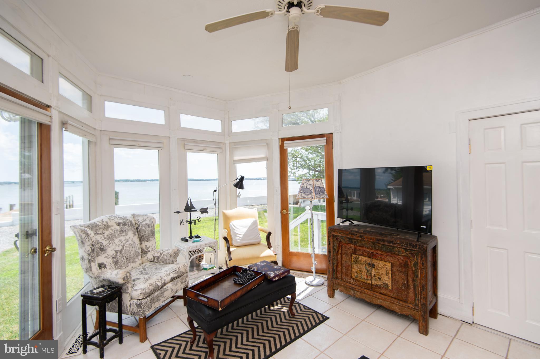 1 West End Avenue Cambridge, MD 21613 - Photo 12 of 33 a living room with furniture and a flat screen tv