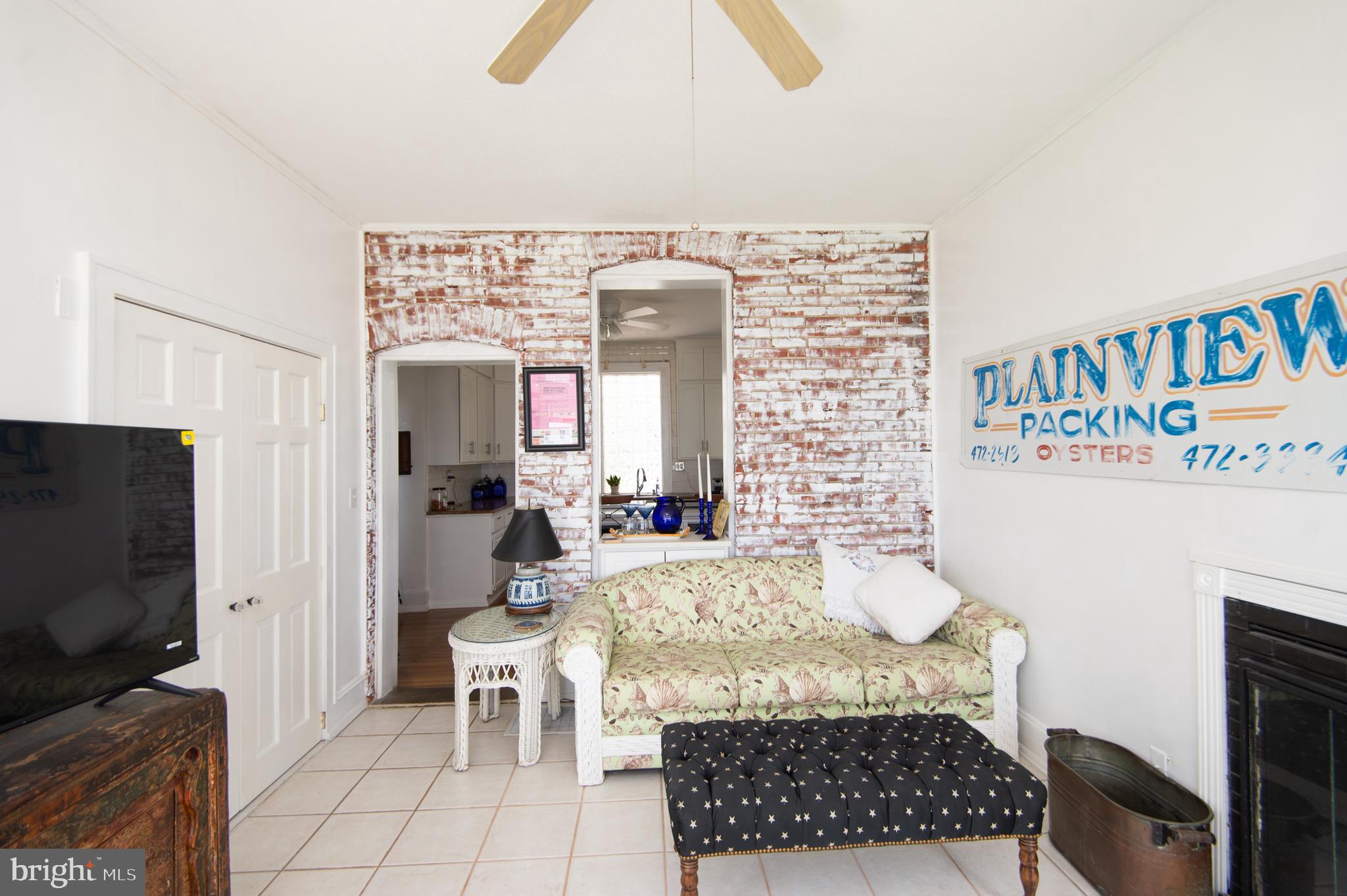 1 West End Avenue Cambridge, MD 21613 - Photo 14 of 33 a living room with furniture and a flat screen tv