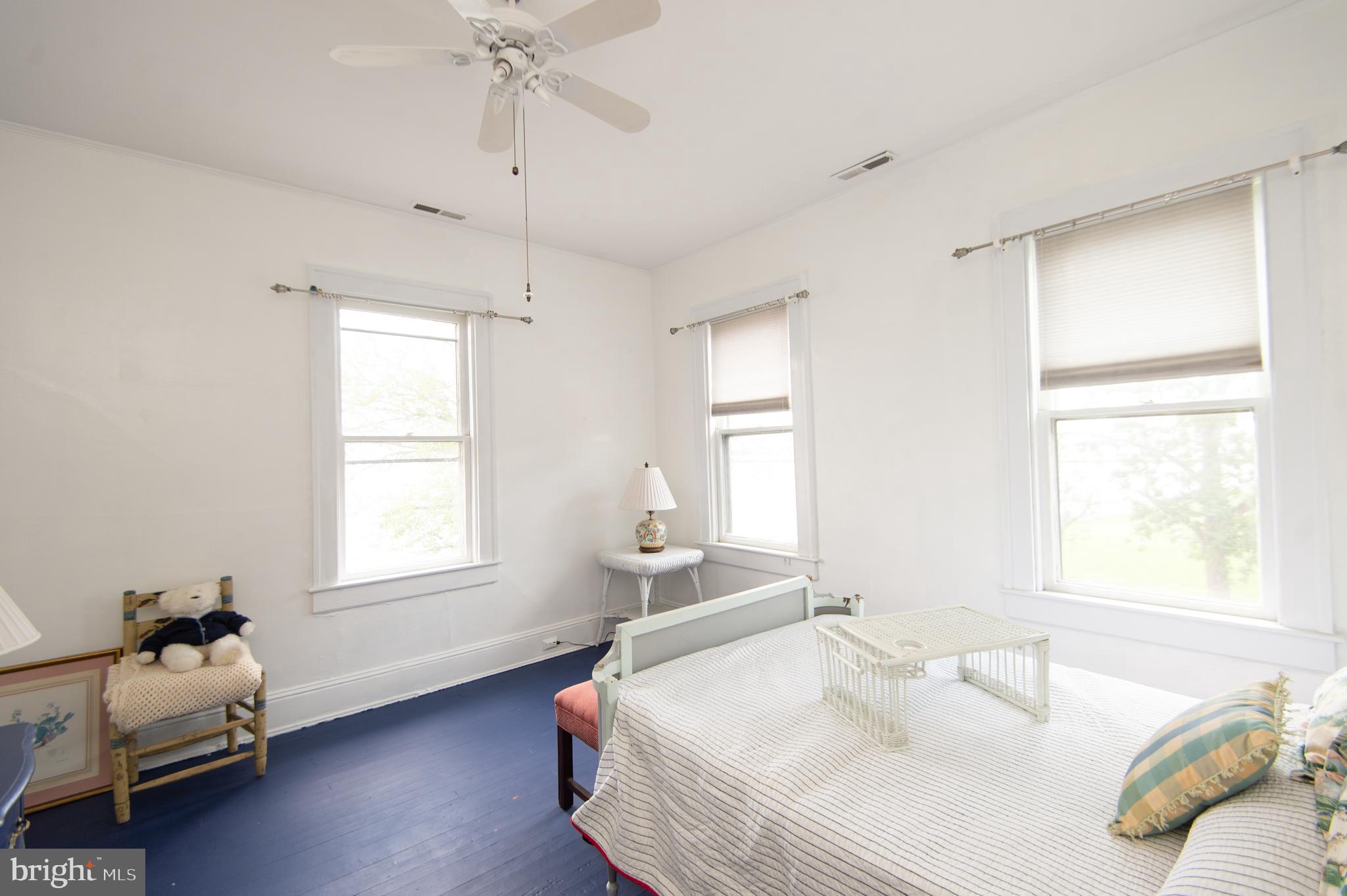 1 West End Avenue Cambridge, MD 21613 - Photo 17 of 33 a spacious bedroom with a bed and a window