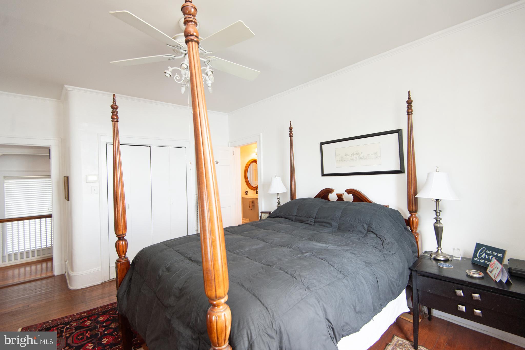 1 West End Avenue Cambridge, MD 21613 - Photo 18 of 33 a bedroom with a bed and a dresser with mirror
