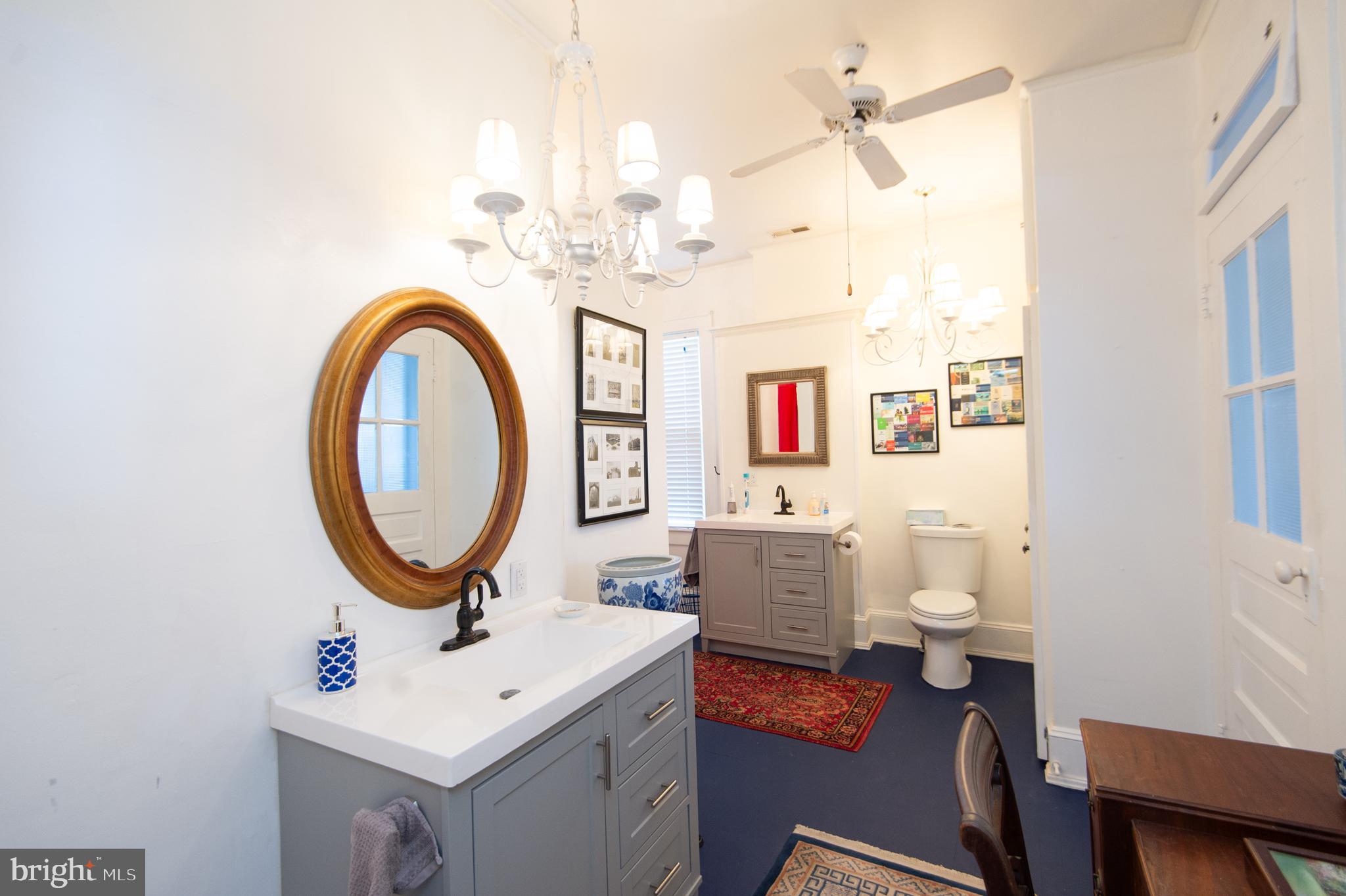 1 West End Avenue Cambridge, MD 21613 - Photo 19 of 33 a bathroom with a sink a mirror and a toilet