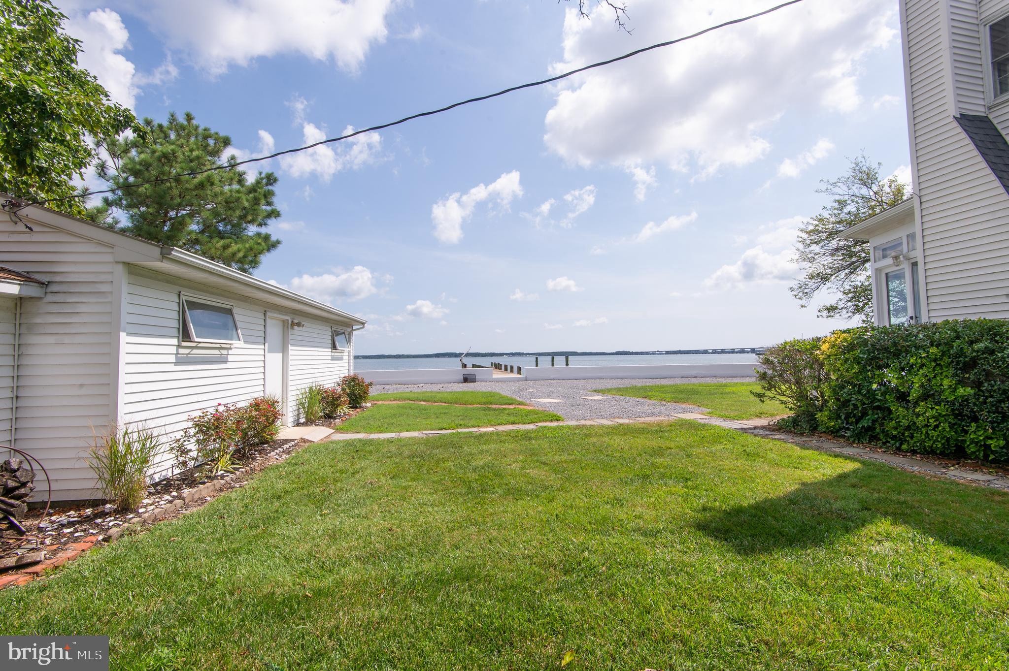 1 West End Avenue Cambridge, MD 21613 - Photo 24 of 33 a view of a house with a yard and a large tree