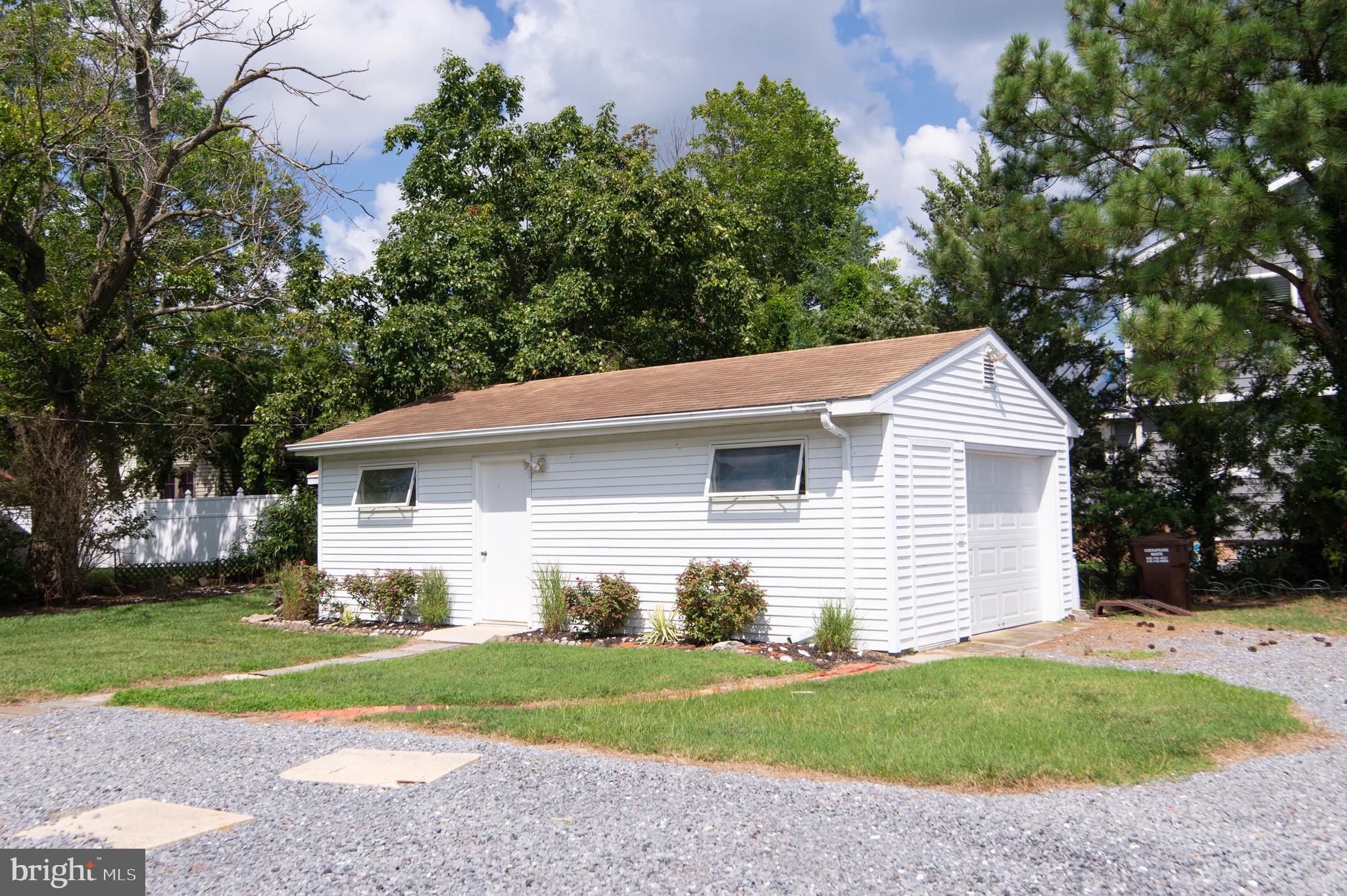 1 West End Avenue Cambridge, MD 21613 - Photo 25 of 33 a front view of house with yard and trees