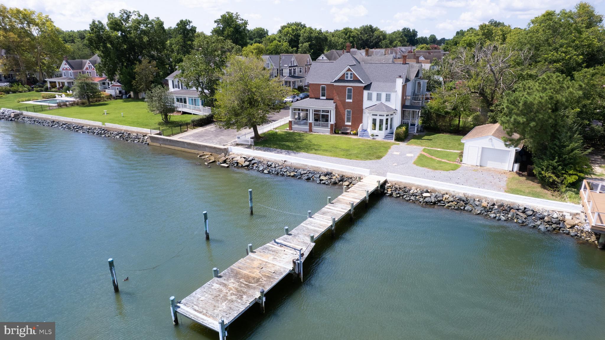 1 West End Avenue Cambridge, MD 21613 - Photo 29 of 33 an aerial view of a house with a garden and lake view