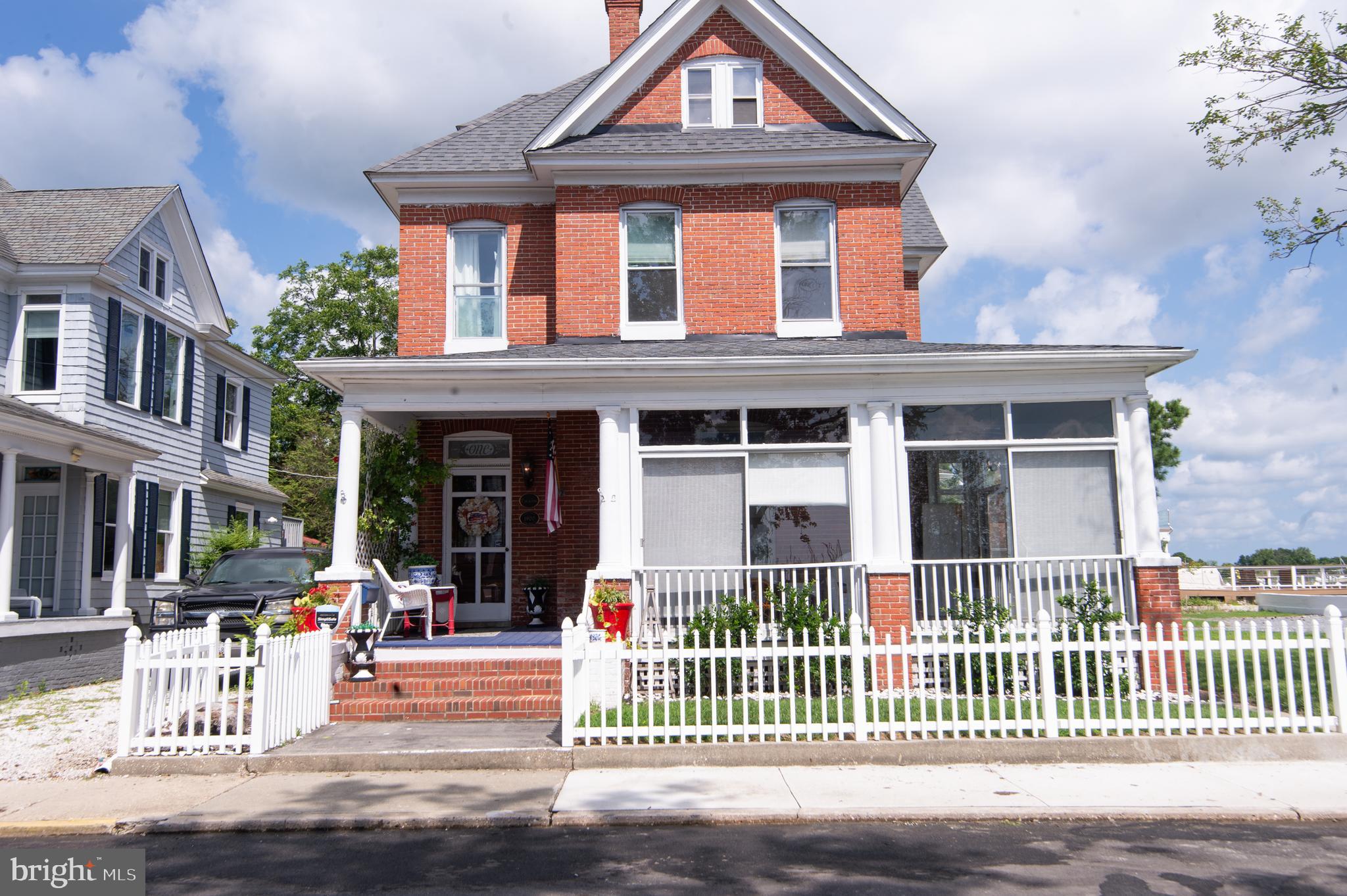 1 West End Avenue Cambridge, MD 21613 - Photo 31 of 33 front view of a brick house with a porch
