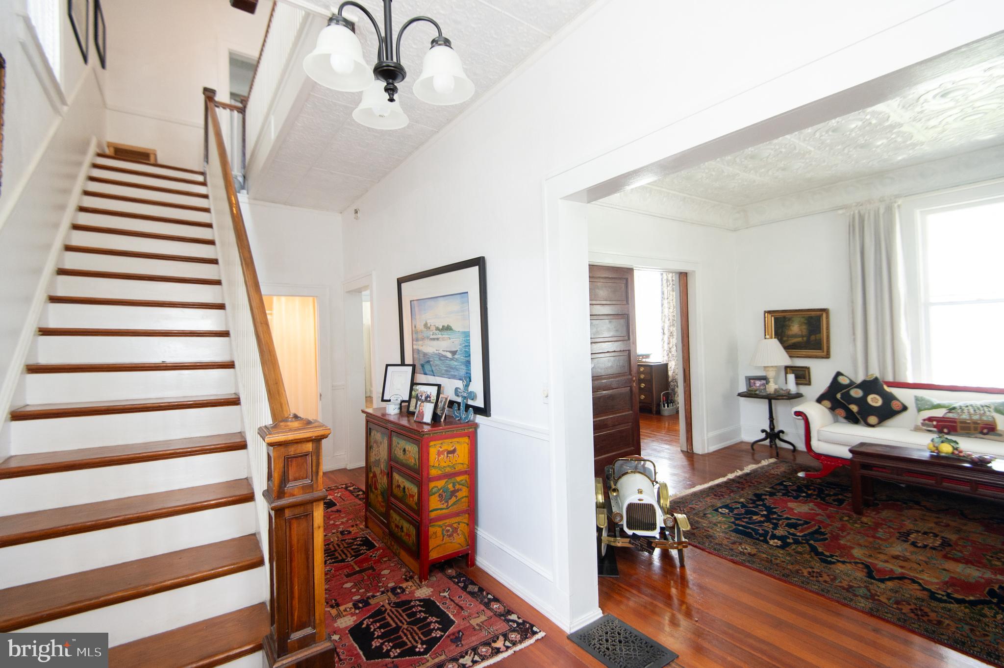 1 West End Avenue Cambridge, MD 21613 - Photo 5 of 33 a living room with furniture and a fireplace