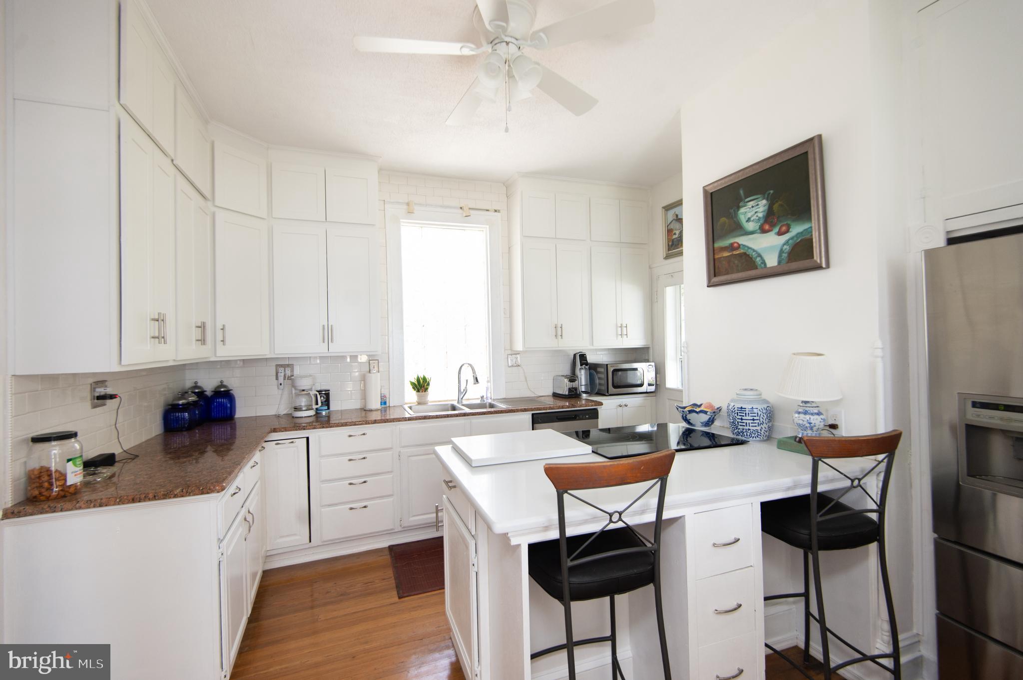 1 West End Avenue Cambridge, MD 21613 - Photo 9 of 33 a kitchen with a sink cabinets and window