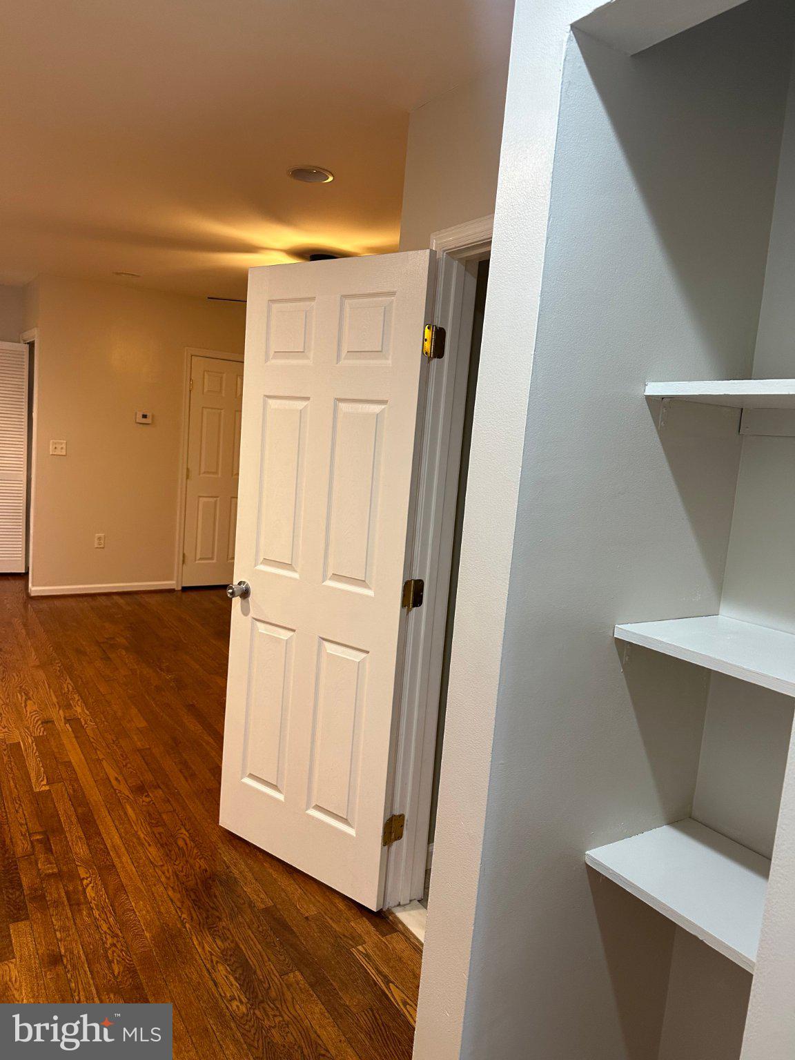 1913 Rosedale Street Northeast, Unit 1 Washington, DC 20002 - Photo 8 of 12 a view of a hallway with wooden floor
