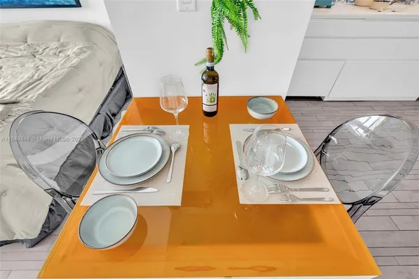 a kitchen with granite countertop lots of counter top space and wooden floor