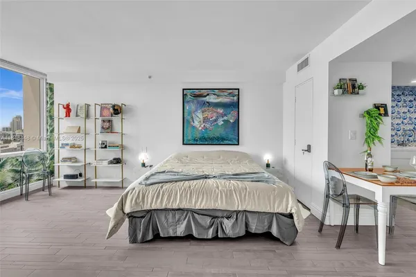 a bedroom with a bed and a cabinets