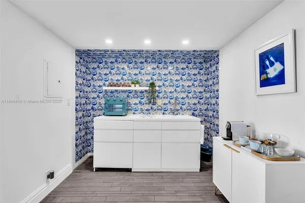 a room with a stove and a refrigerator