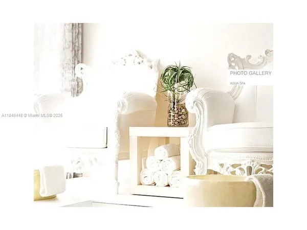 a view of a patio with chairs and a table