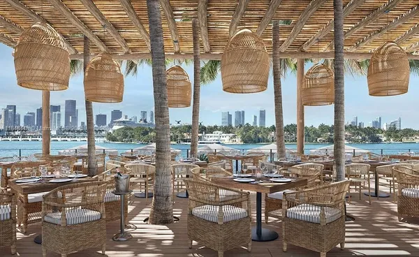 a view of a chairs and tables in patio