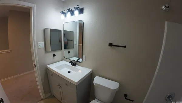 a bathroom with a shower and toilet