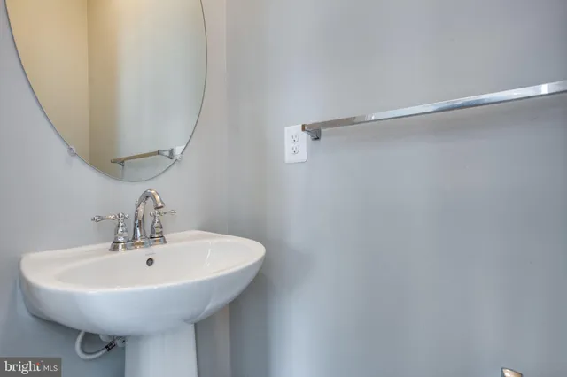 a bathroom with a sink and mirror