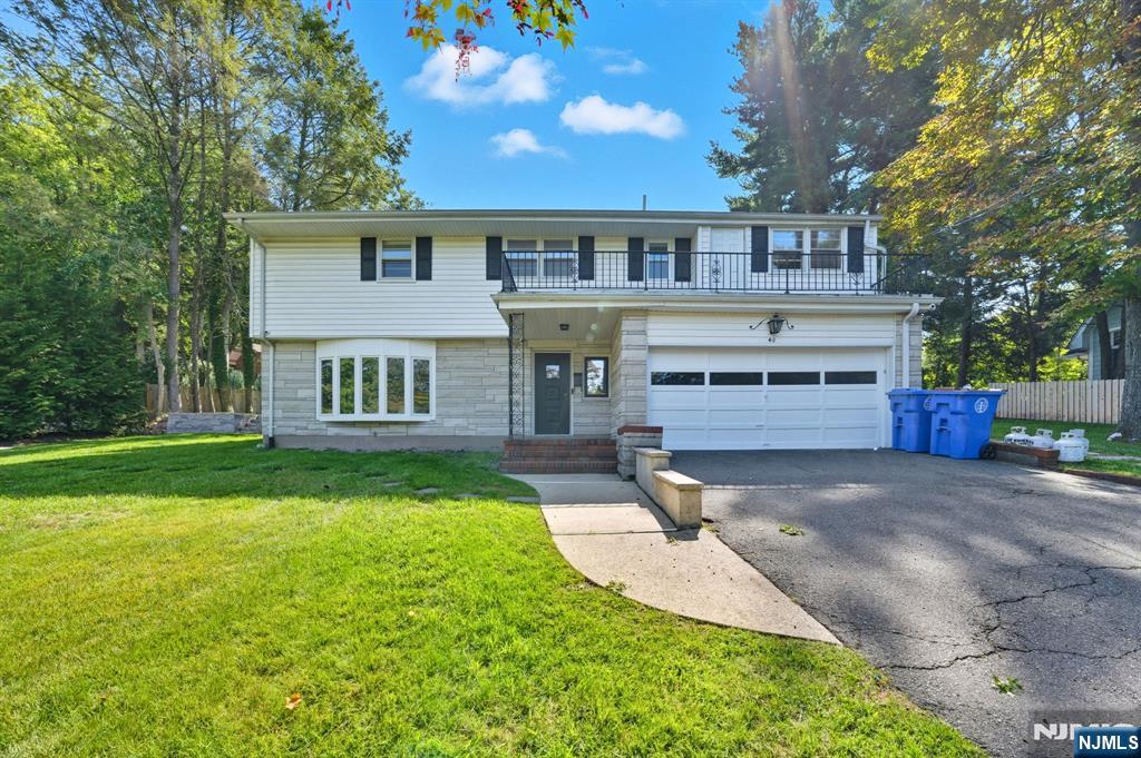 40 Magnolia Avenue Tenafly, NJ 07670 - Photo 1 of 48 a view of a house with a yard and tree s