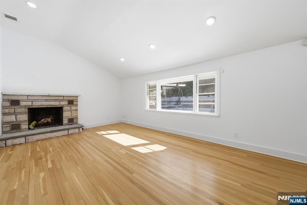 40 Magnolia Avenue Tenafly, NJ 07670 - Photo 22 of 48 a view of empty room with wooden floor and fireplace