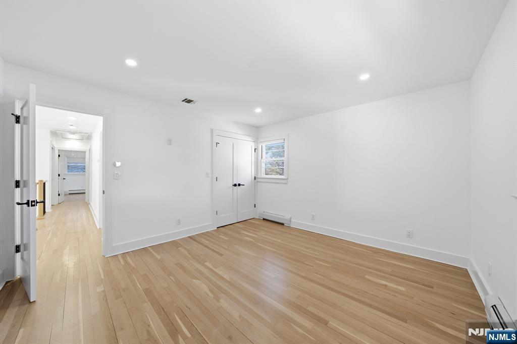 40 Magnolia Avenue Tenafly, NJ 07670 - Photo 24 of 48 wooden floor in an empty room with a window