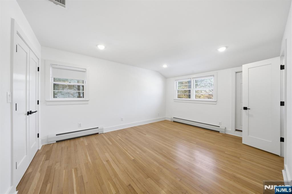 40 Magnolia Avenue Tenafly, NJ 07670 - Photo 31 of 48 an empty room with wooden floor and windows